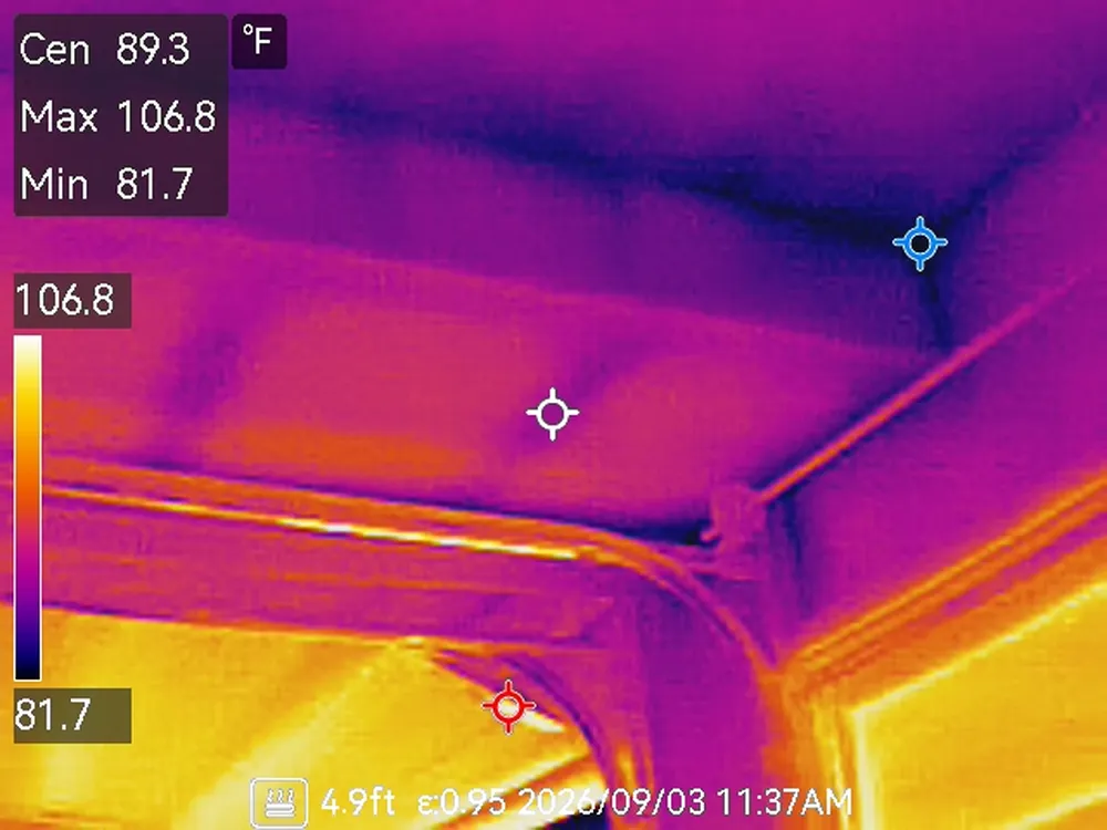 Thermal image of the garage ceiling corner showing a cold band tracking into the beam and wall junction