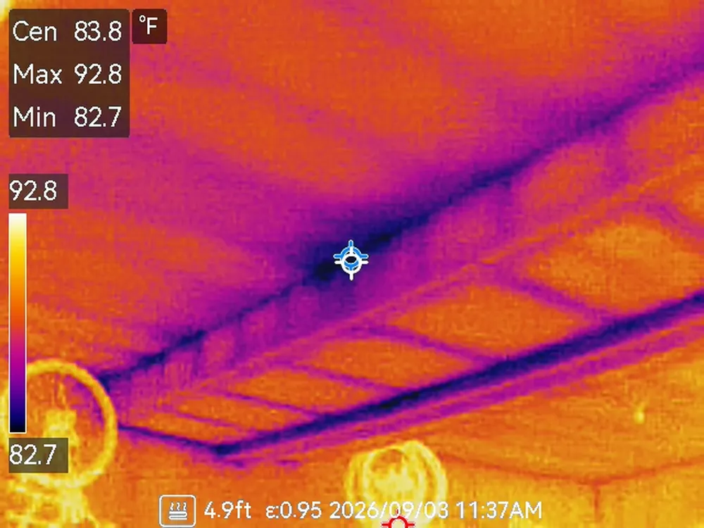 Thermal image of a garage ceiling showing a cold streak where conditioned air is escaping from a supply duct above